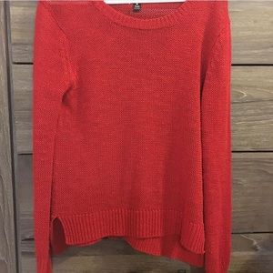 Bright red sweater
